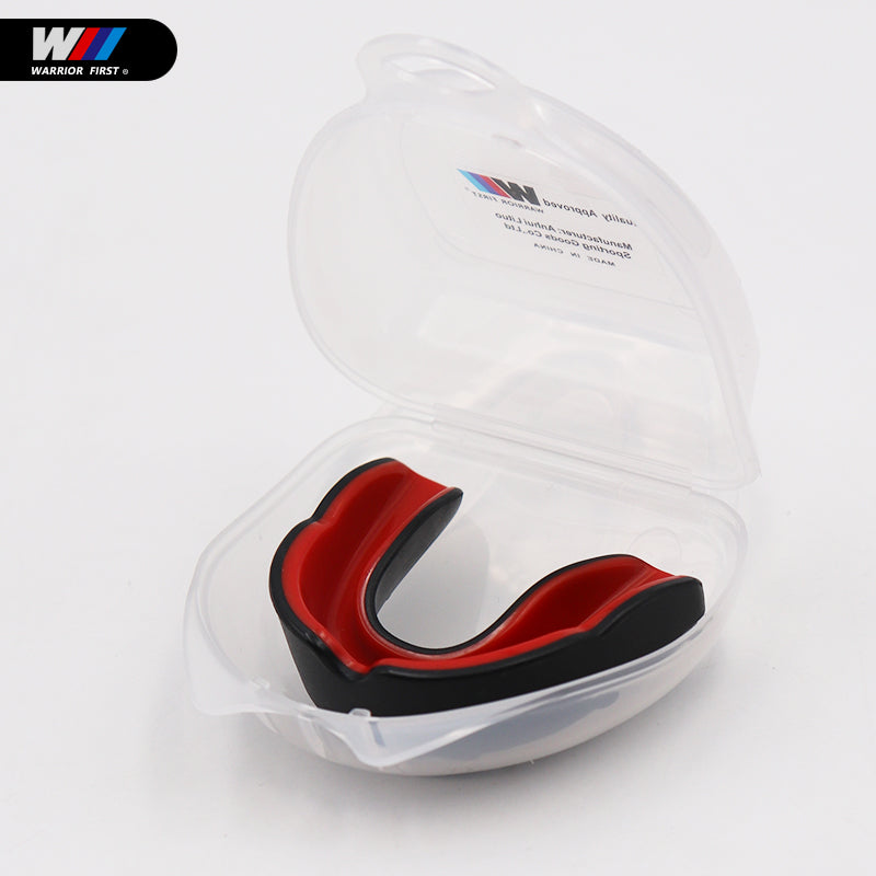 black and red mouth guard in clear case with white background