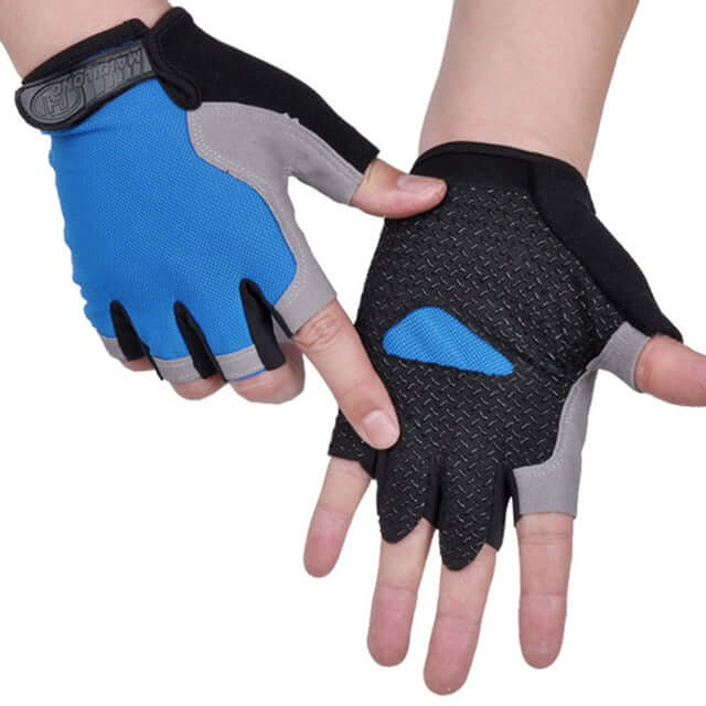hands wearing blue and black half finger cycling gloves with white background