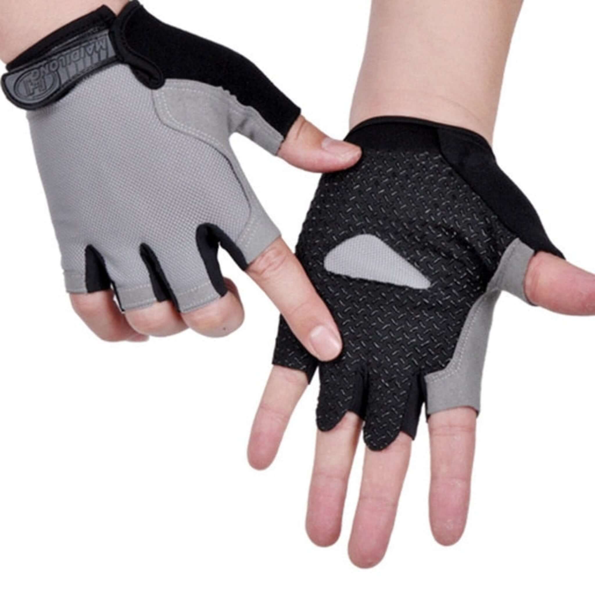 hands wearing black, and gray half finger cycling gloves with white background