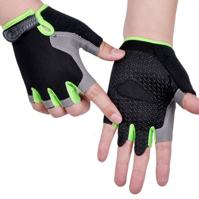 hands wearing green and black half finger cycling gloves with white background