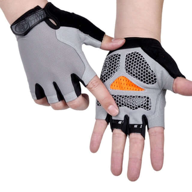 hands wearing orange, black, and gray half finger cycling gloves with white background