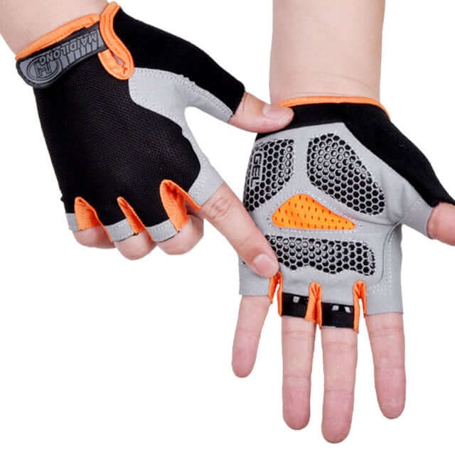 hands wearing orange, black, and gray half finger cycling gloves with white background