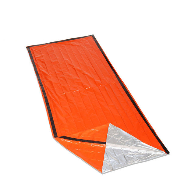 orange sleeping bag with white background