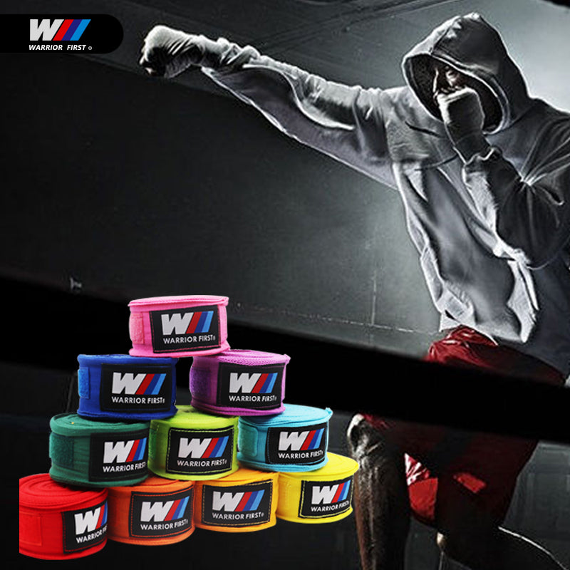 multiple colored boxing hand wraps with man using them