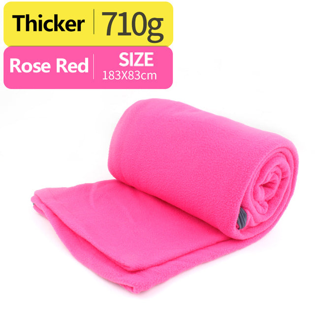 pink sleeping bag with white background