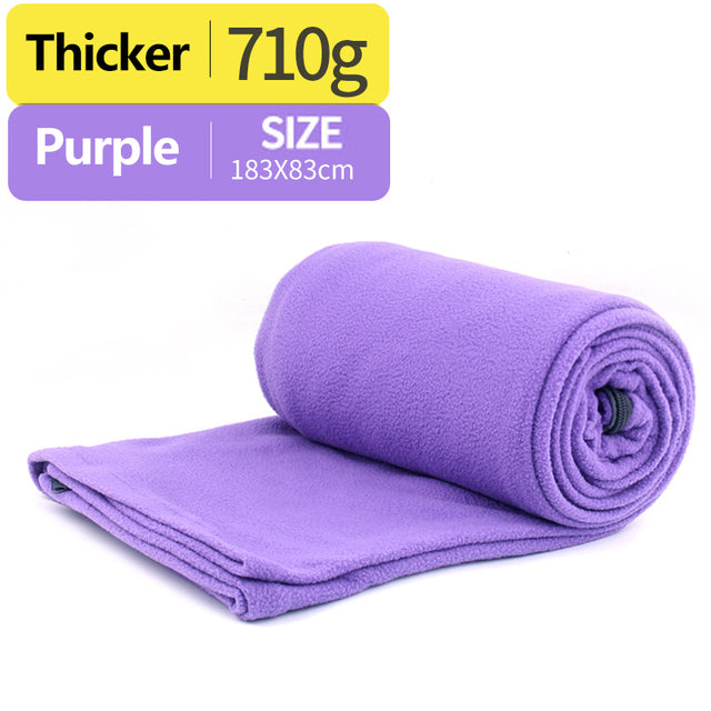 purple sleeping bag with white background