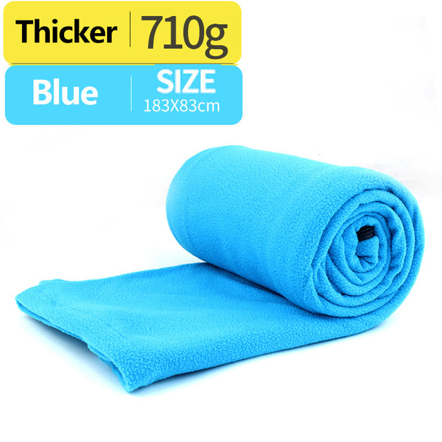 light blue sleeping bag with white background