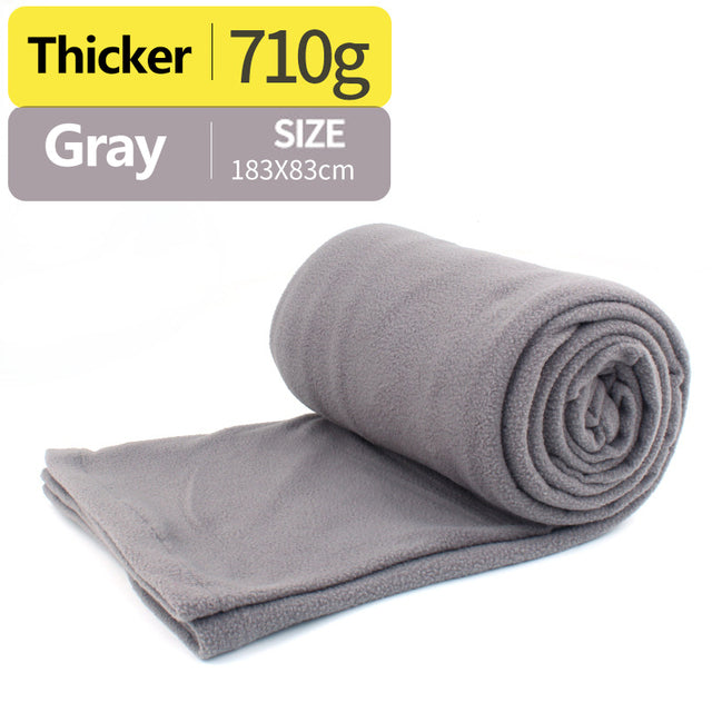 gray sleeping bag with white background